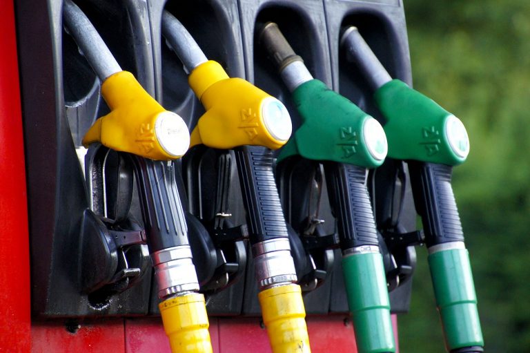 yellow and green gas nozzles in a gas pump