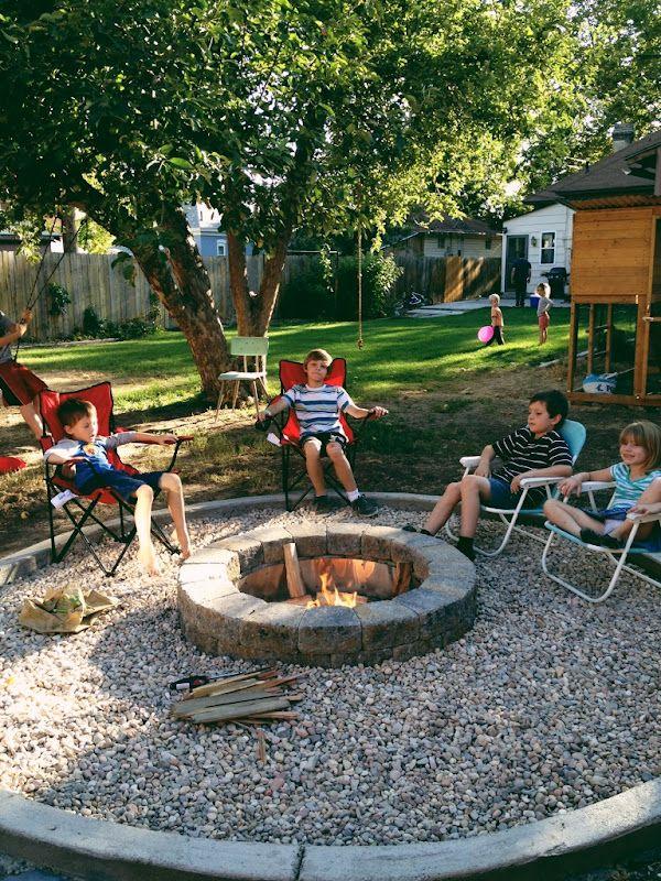 children sitting around a firepit